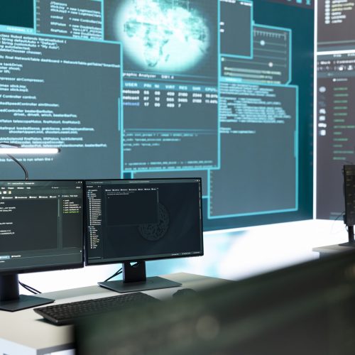 Cyber security monitoring room with high tech equipment. Governmental focus on cyber operations, cyber surveillance, and digital threats protection in an empty command workspace.